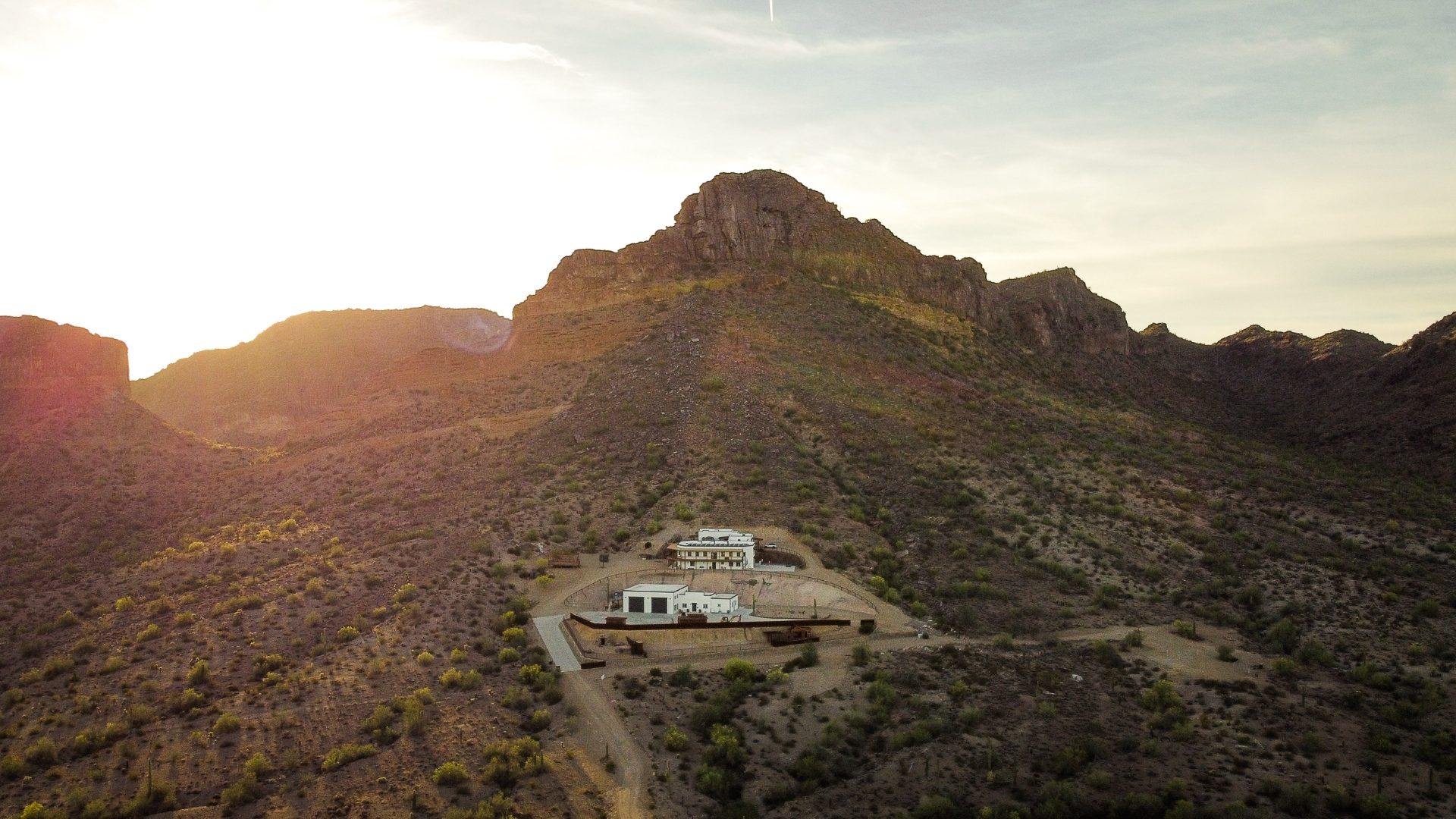 Aerial drone photo of an Arizona property at golden hour in the Santan Mountains