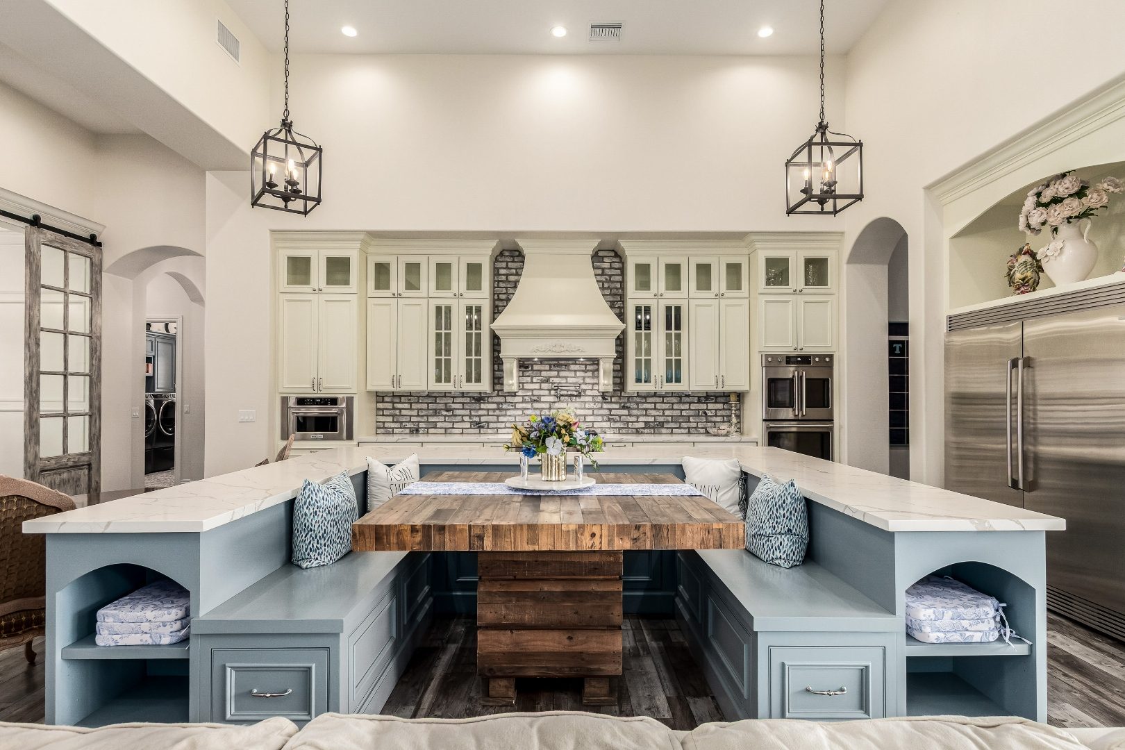 Luxury kitchen interior photo with custom banquette seating