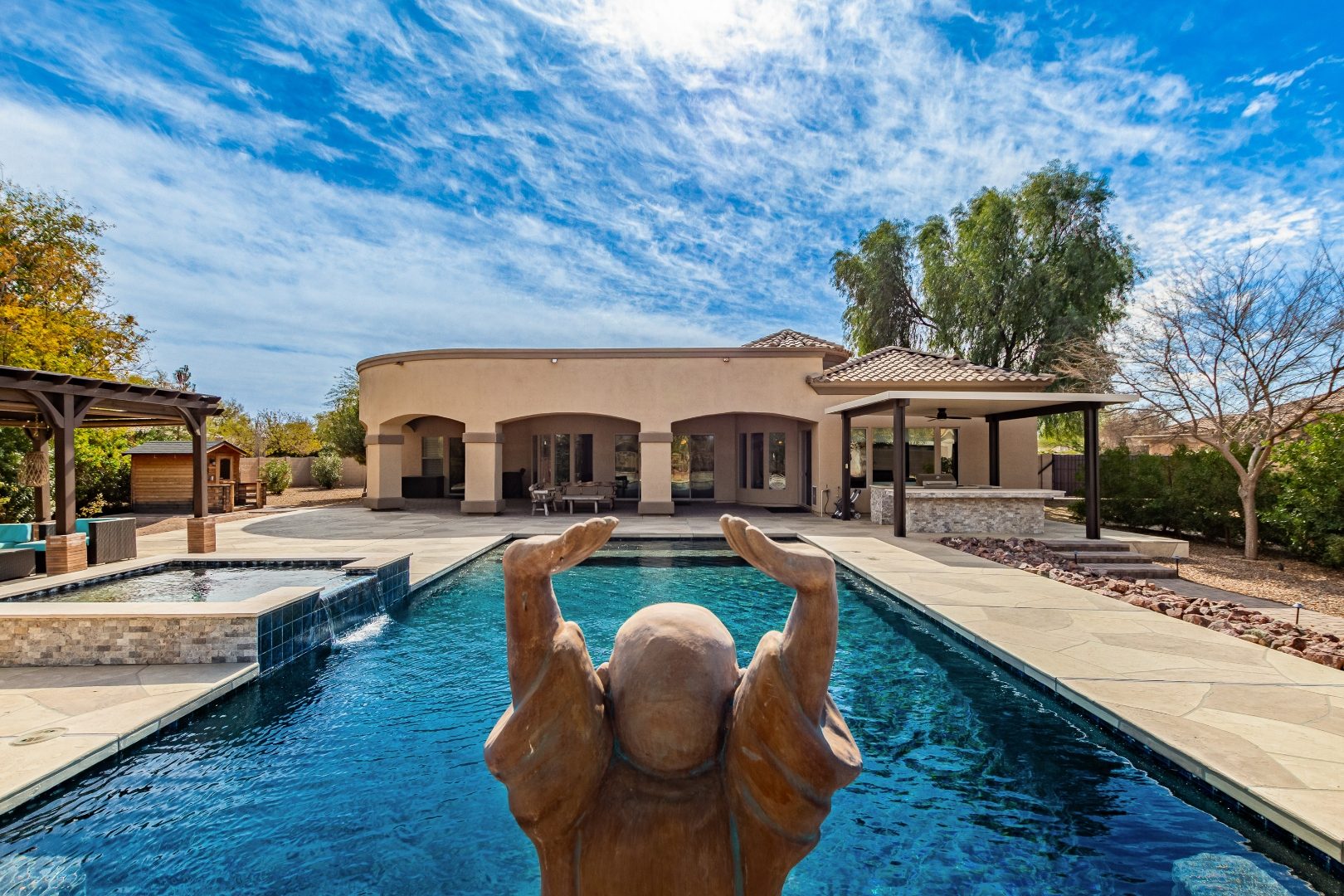 Backyard pool and patio exterior photo of an Arizona luxury home